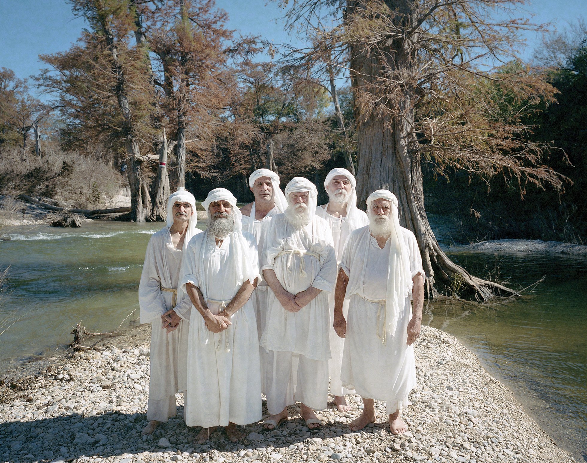 Mandaeans at the Guadalupe River after their baptism. From left: Bahman Ebadeh Ahvazi, Shahram Ebadfardzadeh, Sobhan Zahrooni, his father Hanoon Zahrooni, Sabah Al Dehaisy, and Hormoz Ebadeh Ahvazi.