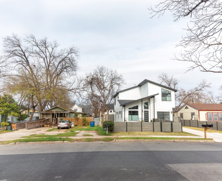 They grow up so fast East Austin “When I work in these old neighborhoods,” Koush says, “I like to respect the scale of the context and massing.” Massing refers to the overall effect of a building’s shape and form. It’s like meeting someone intimidating: Is he coming at you, all broad shoulders and forehead? That’s massing. Koush tries to design new houses that aren’t as domineering as these two, because they’re about the same height or width and they use the same fundamental shapes as the houses that are already there. Plus, a more modest scale leaves room to preserve and plant trees, increasingly necessary in warming Texas cities to provide shade, sop up increased rainfall and floodwater, and sequester carbon from the atmosphere.