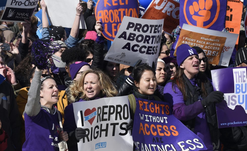Pro-abortion rights protesters rally outside the Supreme Court.