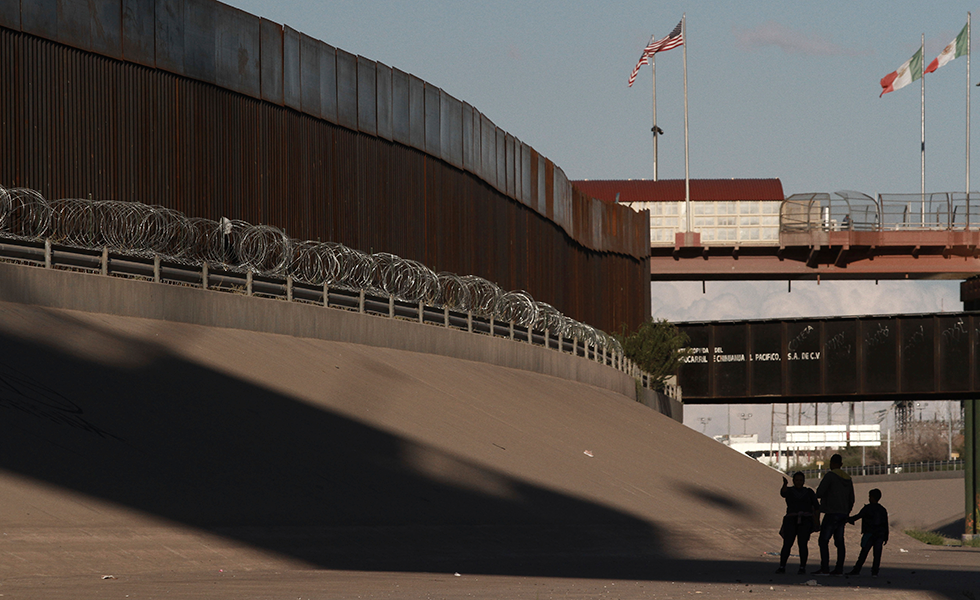 A family crosses the border to the United States and plans to be taken in by U.S. authorities so they can apply for asylum during an artist protest on the border of Mexico and the U.S., in Ciudad Juarez, Mexico, Saturday, Sept. 28, 2019. Artists, musicians, and writers protested against the militarization of the wall by painting murals, performing music and reading literature. (AP Photo/Christian Chavez)