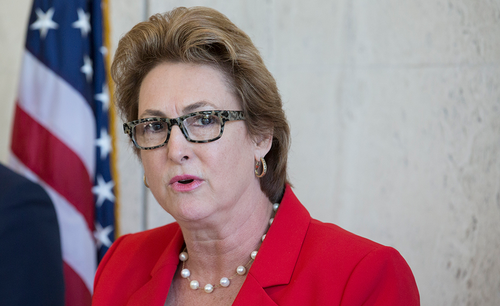 Harris County District Attorney Kim Ogg, center, announces that a grand jury decided to indict Arkema and Michael Keough, vice president of logistics division of the company, for reckless assault during a press conference on Wednesday, April 10, 2019, in Houston. Ogg said the trial will begin in May. (Yi-Chin Lee/Houston Chronicle via AP)