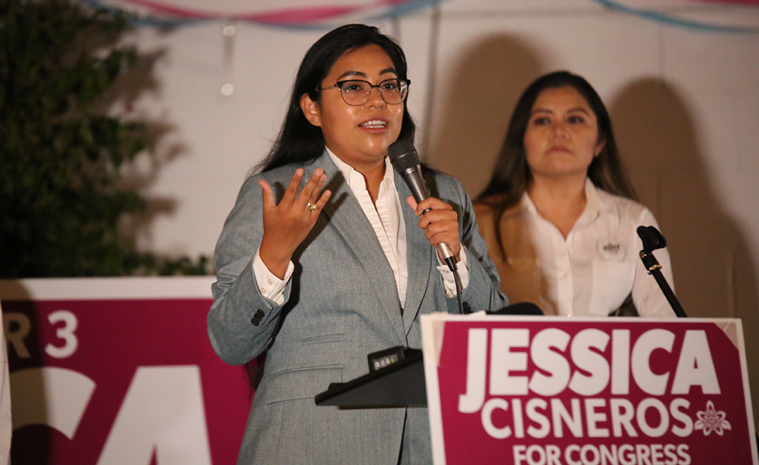 Jessica Cisneros speaks to the crowd at her campaign watch party.