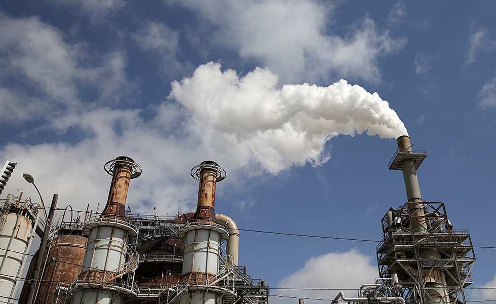 In this March 29, 2018, photo, steam is released out of the Valero Refinery in Houston. More than a year after Hurricane Harvey slammed into the Texas coast, state environmental authorities have only just begun enforcement actions against a handful of companies deemed responsible for some of the most massive air and water pollution incidents reported during and immediately after the storm. (Elizabeth Conley/Houston Chronicle via AP)