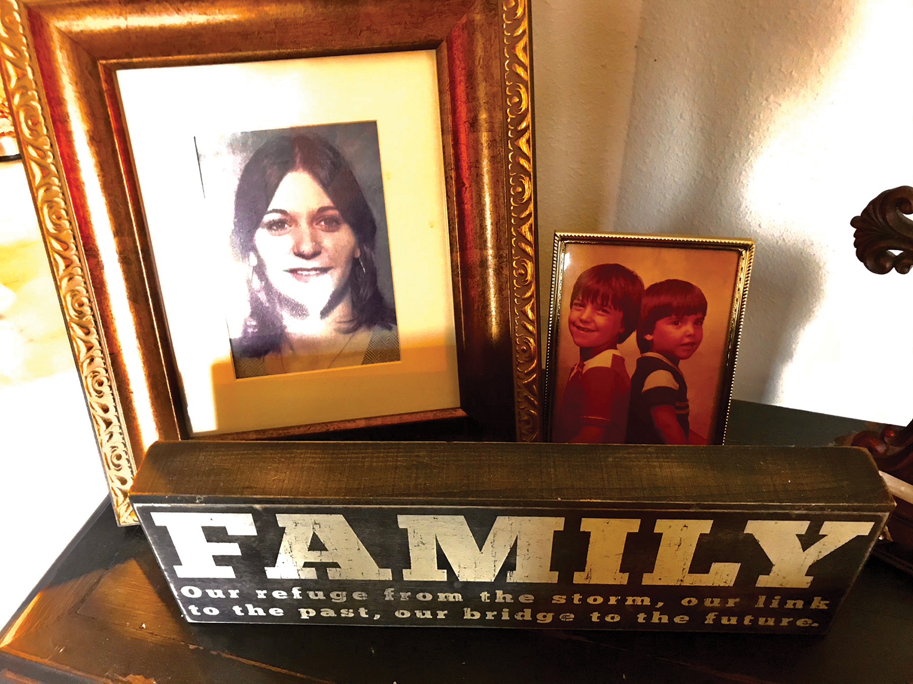 Dianne Gonsoulin Hasting’s Austin apartment contains many family heirlooms. A framed portrait of Donna sits next to a picture of Donna’s sons.