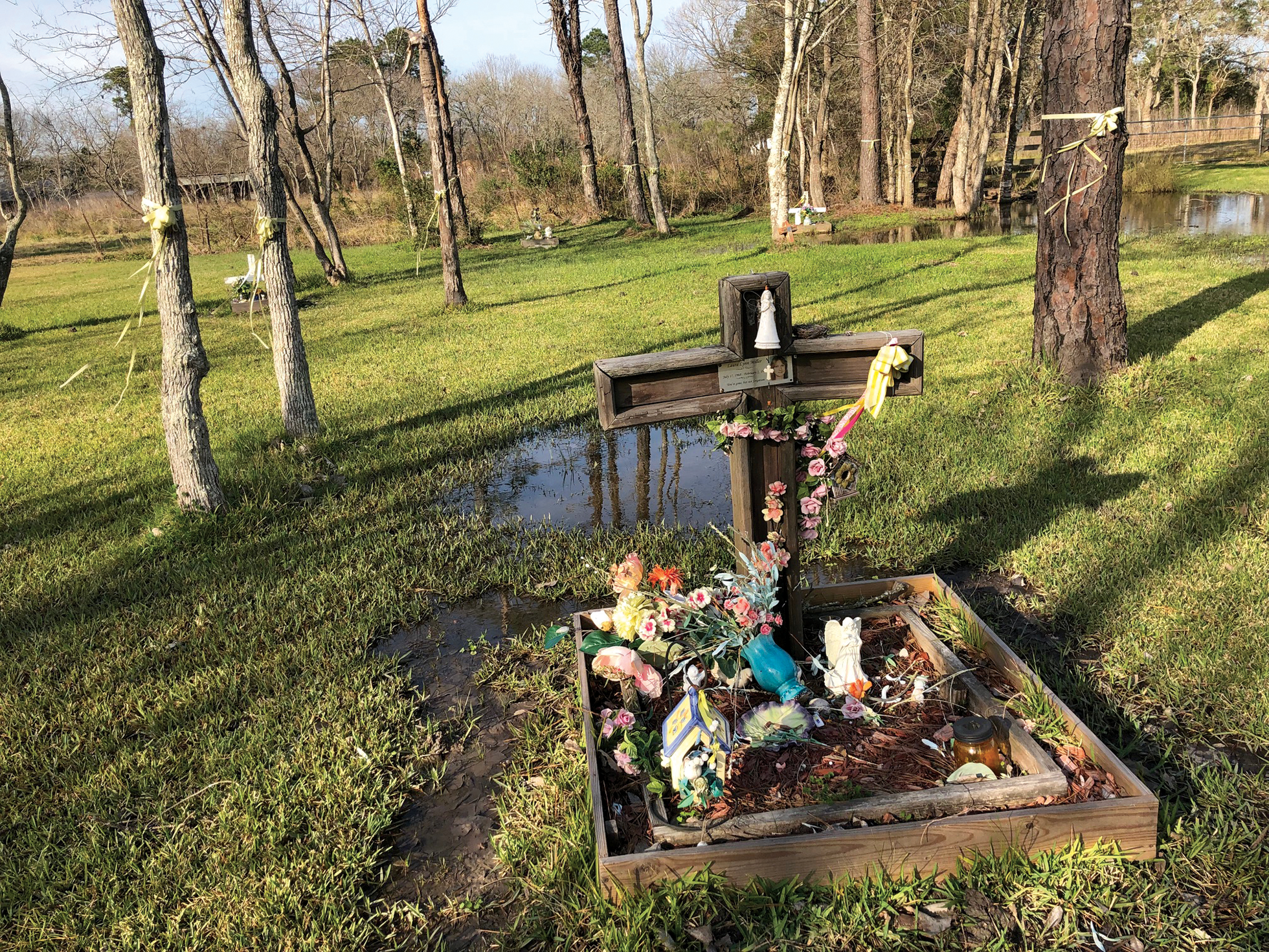 One of the monuments built for the Killing Fields murder victims in a grove of trees off Calder Drive in League City, near where their bodies were found.
