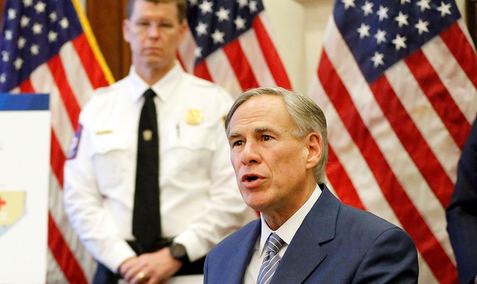 Texas Gov. Greg Abbott announces the US Army Corps of Engineers and the state are putting up a 250-bed field hospital at the Kay Bailey Hutchison Convention Center in downtown Dallas during a news conference at the Texas State Capitol in Austin, Sunday, March 29, 2020. For the COVID-19 update and announcement, the Governor was joined by U.S. Army Corps of Engineers Brigadier General Paul Owen (left) and Texas Division of Emergency Management Chief Nim Kidd. (Tom Fox/The Dallas Morning News via AP, Pool)