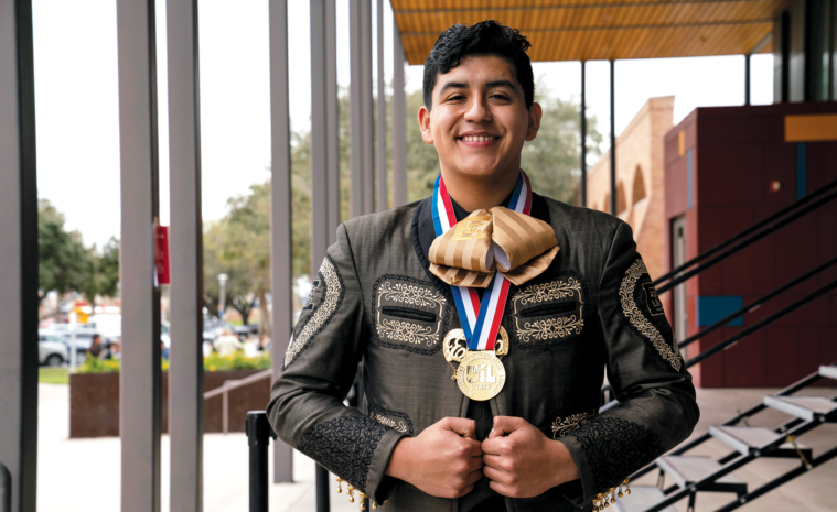 Daniel Estrada, who transferred to Edcouch-Elsa High School to join Mariachi Juvenil Azteca, shows off his outstanding performer medal from the UIL State Mariachi Festival.