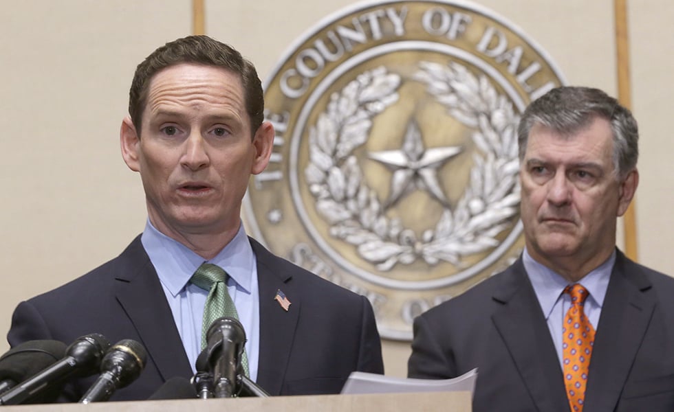 Dallas County Judge Clay Jenkins, left, speaks as Dallas Mayor Mike Rawlings, right, looks on during a news conference Monday, Oct. 20, 2014, in Dallas. Ebola fears began to ease for some Monday as a monitoring period passed for those who had close contact with Thomas Eric Duncan, a victim of the disease, and after a cruise ship scare ended with the boat returning to port and a lab worker on board testing negative for the virus. (AP Photo/LM Otero)