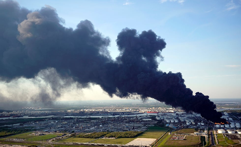 In this March 18, 2019 file photo, a plume of smoke rises from a petrochemical fire at the Intercontinental Terminals Company in Deer Park, Texas. It's been four months since the explosion and fire at a Houston-area petrochemical storage site and experts are still working to dispose of millions of gallons of waste and contaminated water. The Houston Chronicle reports Intercontinental Terminals Company must comply with a 31-page management plan that details how waste is sampled and identified, stored and finally disposed of. More than 21 million gallons of water mixed with product and firefighting foam were collected from the tank farm and Houston Ship Channel following the March 17 accident that triggered air quality warnings. (AP Photo/David J. Phillip, File)