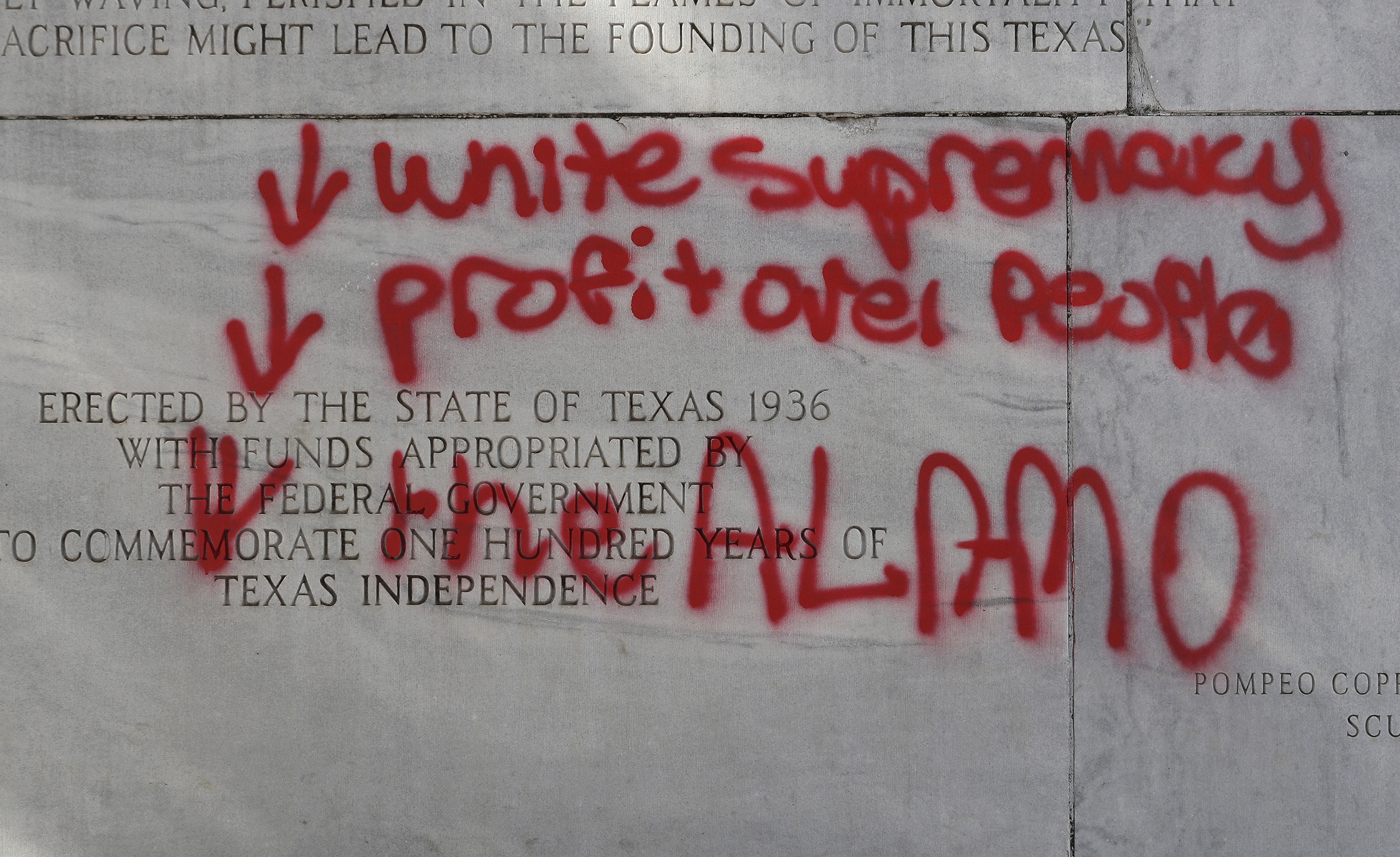 A spray painted message is seen on the Alamo Cenotaph in San Antonio, Friday, May 29, 2020. The monument was vandalized over night. (AP Photo/Eric Gay)