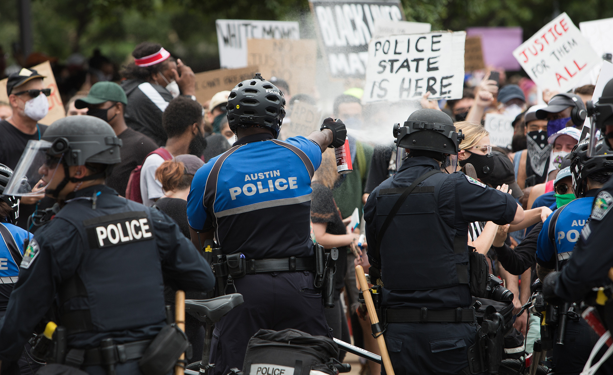 Police clash with protestors in downtown Austin Sunday afternoon.