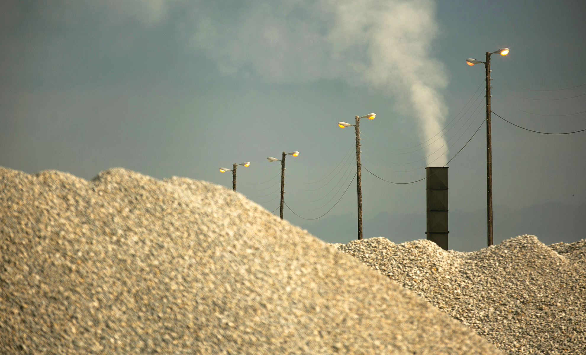 A smokestack hovers over an industrial facility bordering Joppa, which is in one of the most polluted zip codes in Dallas.