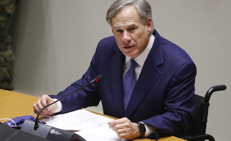 Governor Greg Abbott speaks at a news conference at Dallas City Hall in June.