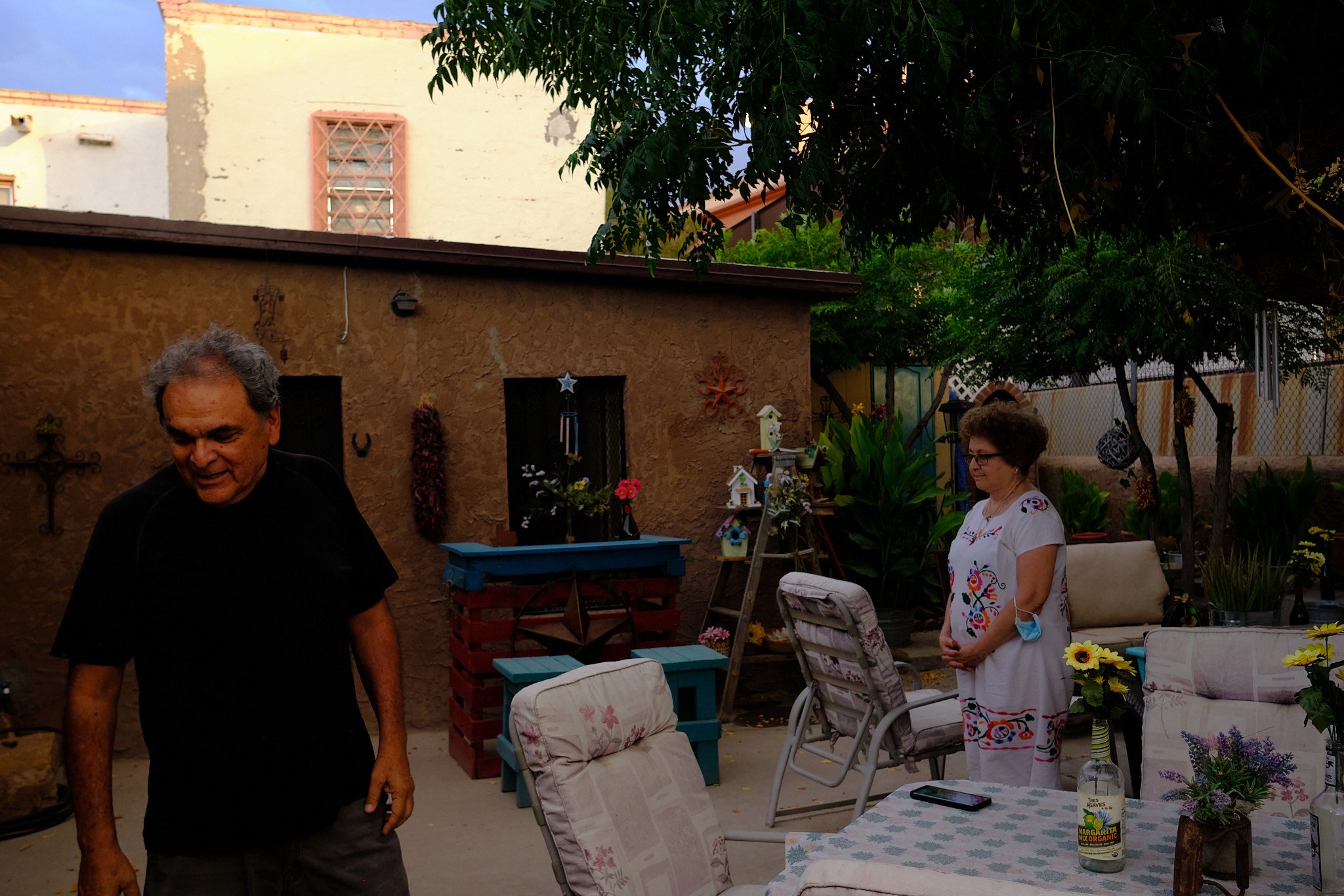 Rogelio Chavira is for Biden. Dolores Chacon is for Trump. The border fence passes through the couple’s backyard.