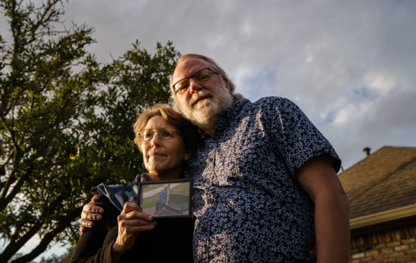 Chris Mabe, left, with her husband Jim, holding a photo of her 81-year-old mother, Jewel Bergan-Brumbaugh, who died this March.