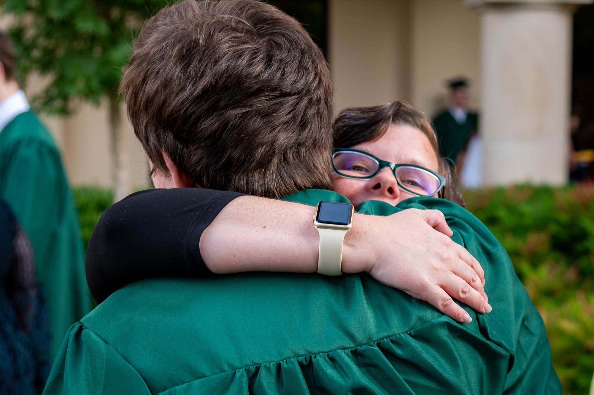 Lauren Rodriguez gives her son Greyson a congratulatory hug after he accepted his high school diploma at a commencement ceremony in early June. The 17-year-old graduated a year early after bullying prompted him to switch into an online school. 