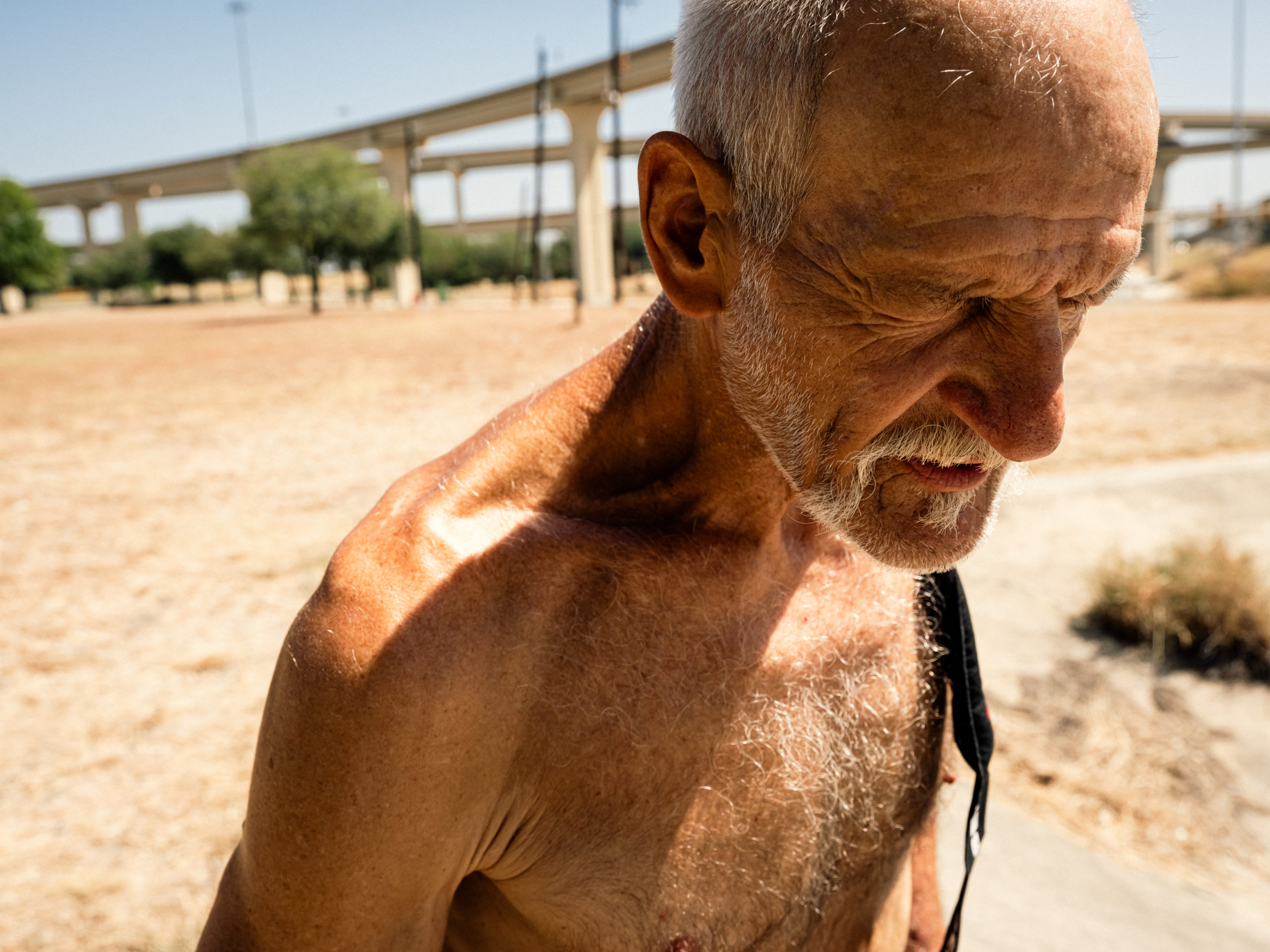 Sergio Palacios, 35, carries a case of water to his morning soccer game in Austin. The National Weather Service issued an excessive heat warning on July 24 for areas of South Texas, including Austin, where the temperature reached 101 degrees.