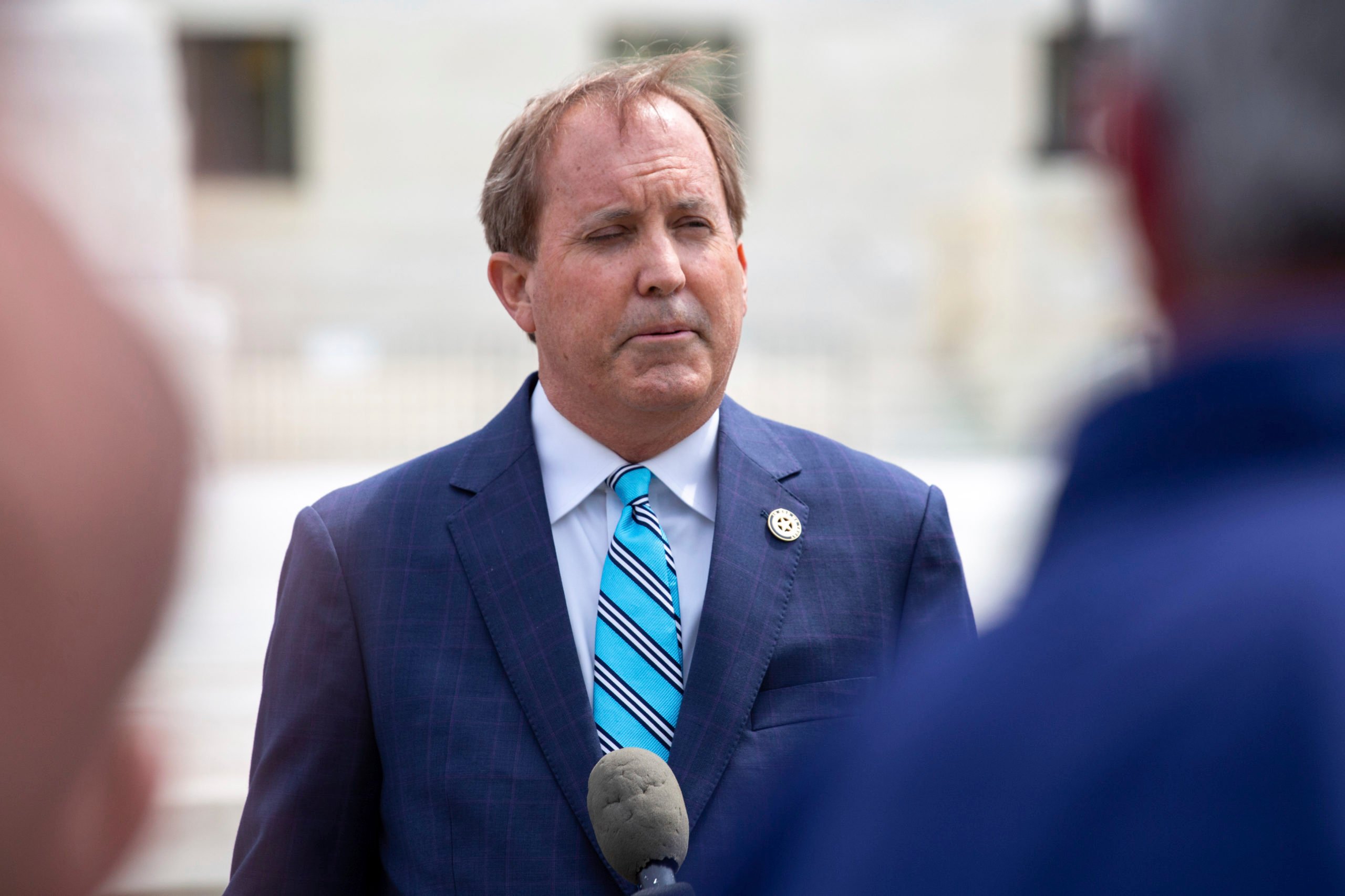 Texas Attorney General Ken Paxton speaks outside of the Supreme Court in Washington, D.C.