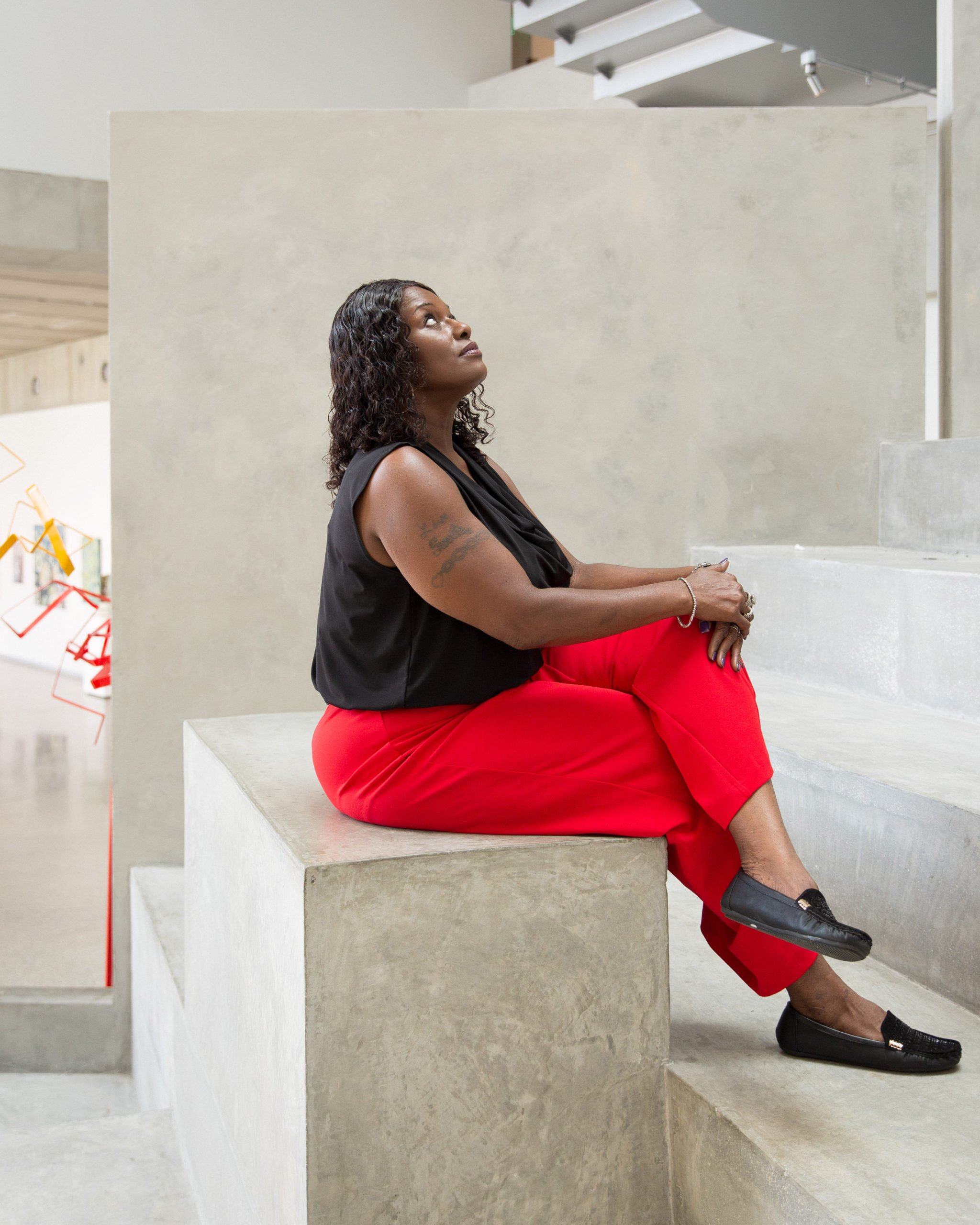 Brenda Phillips of Houston looks contemplatively upward. She has suffered temporary paralysis and decades of pain following spinal operations by Dr. Scheffey.