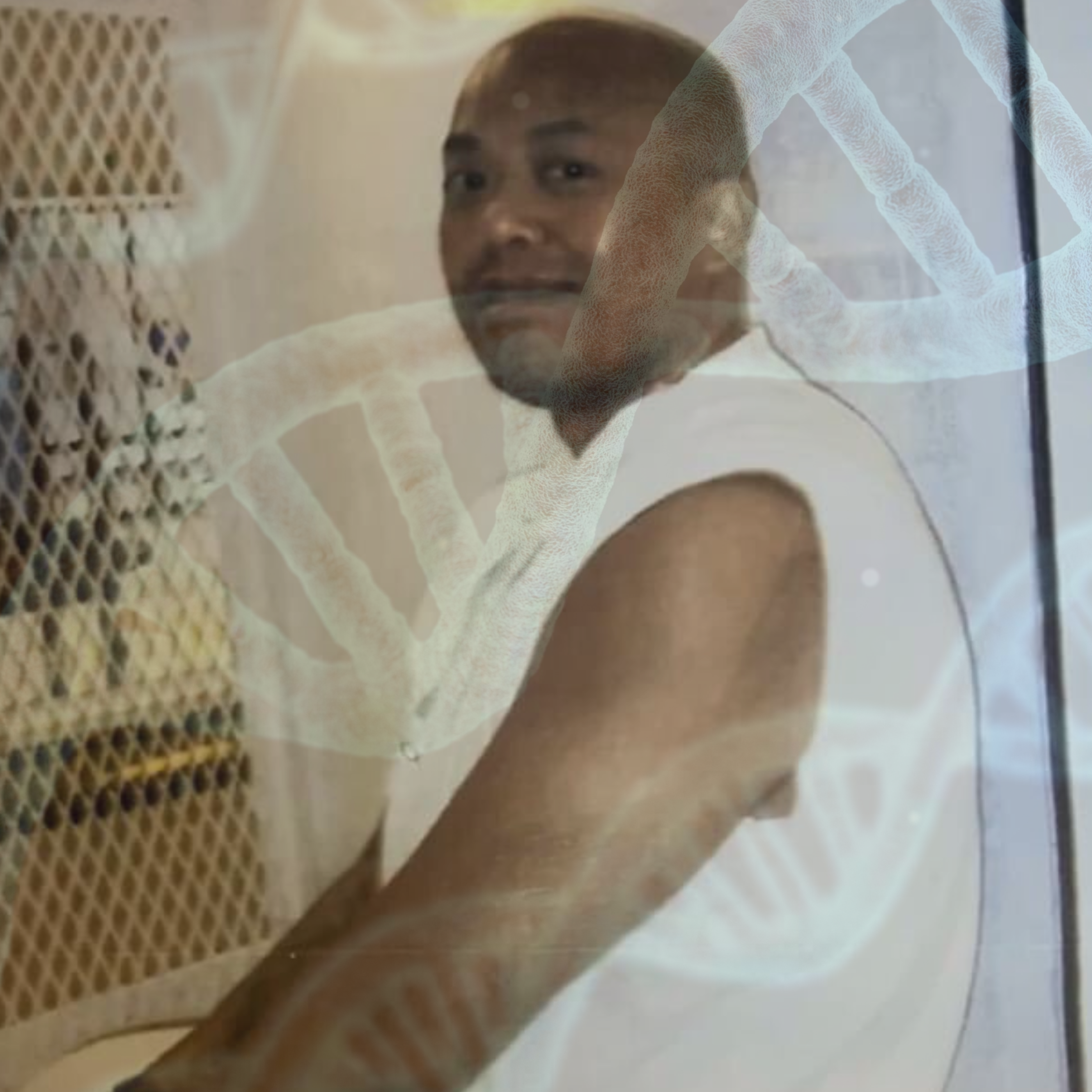 Kosoul Chanthakoummane, a bald Laotian man, sits inside a viewing window in a prison, wearing a sleeveless white top and white pants. His image has been superimposed, partly transparent, atop an illustration of DNA molecules in their double-helix shape.
