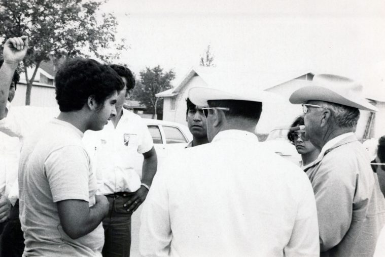 Young protesters speak with law enforcement officials in Uvalde in 1970.