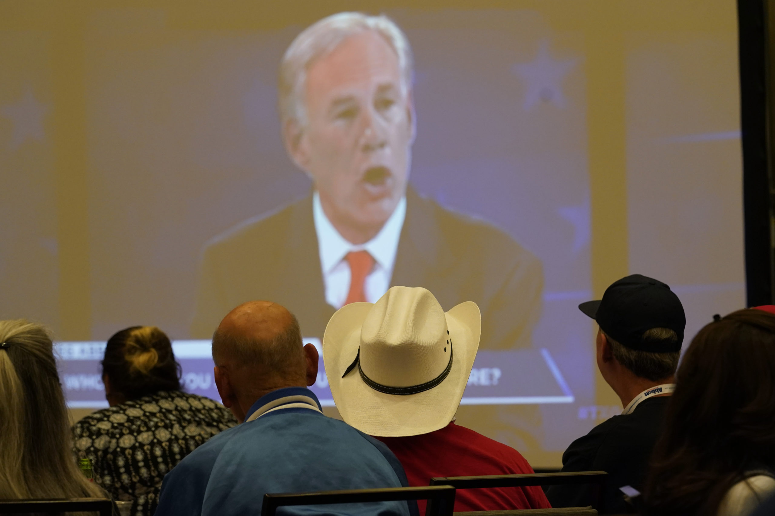 Supporters of Texas Gov. Greg Abbott watch his debate with Texas Democratic gubernatorial candidate Beto O'Rourke.