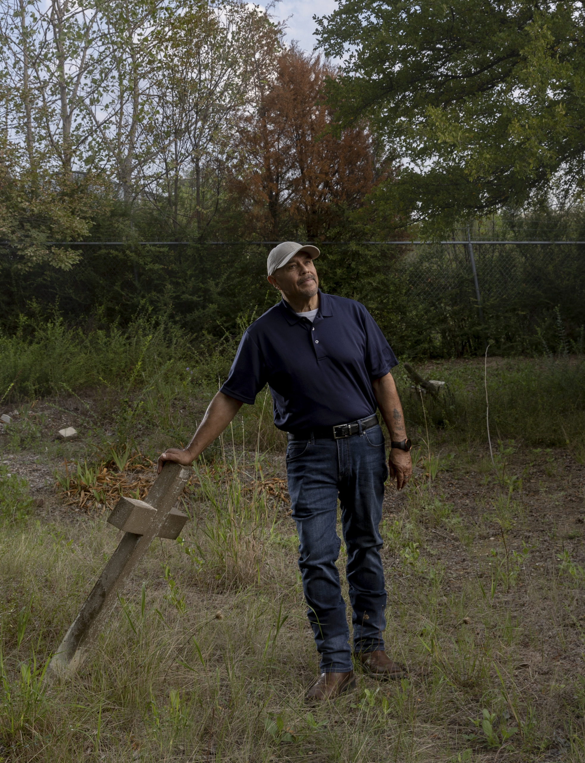 Henry Martinez Jr. on the Campo Santo de Cemeto Grande grounds, where his own family members are buried.