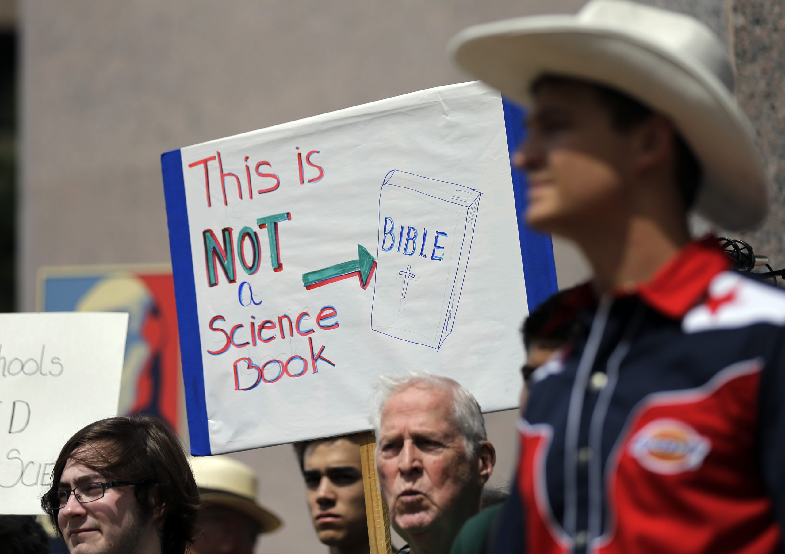 Pro-science supporters rally prior to a State Board of Education public hearing on proposed new science textbooks, in Austin, Texas.