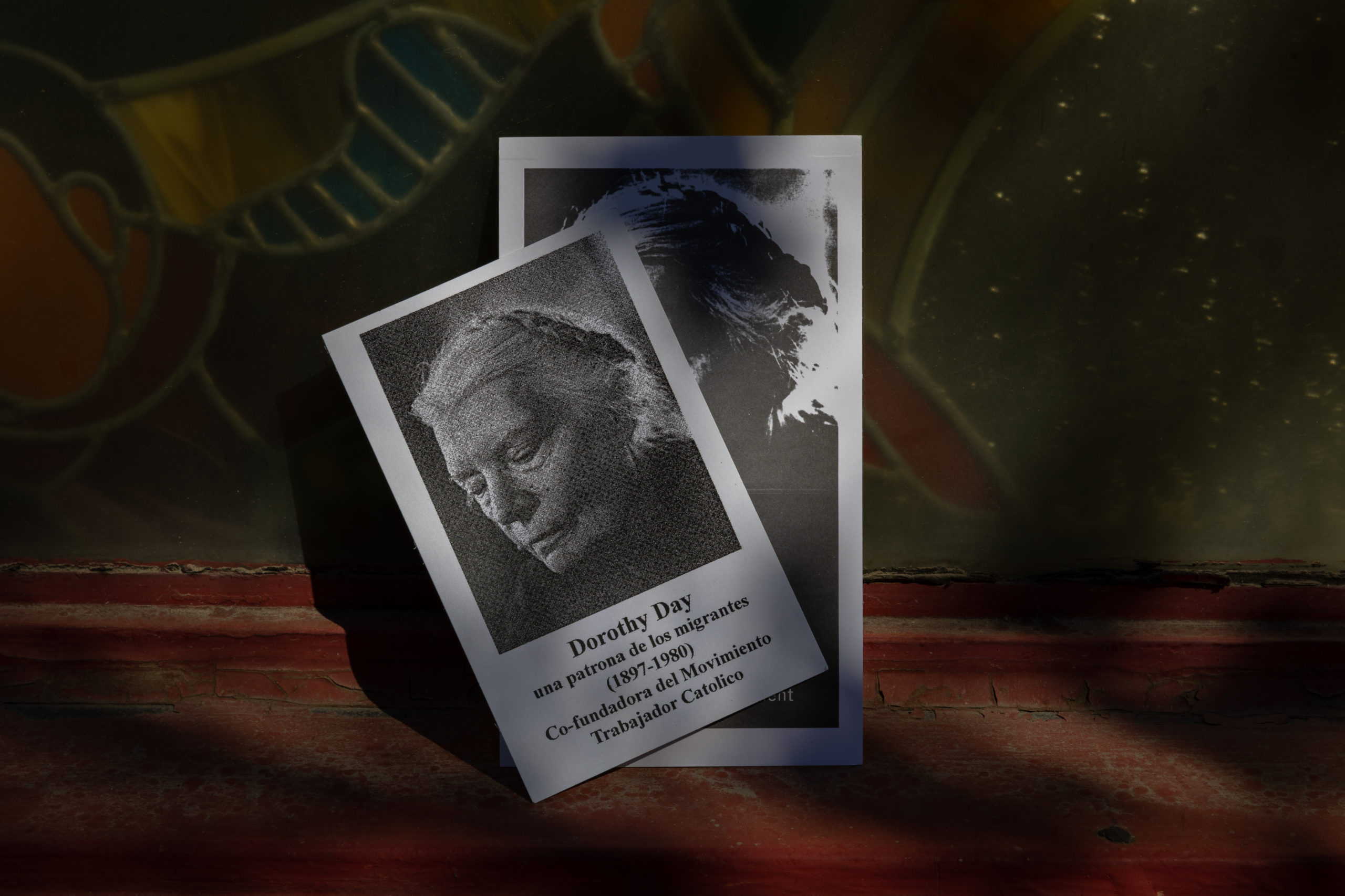Images of Dorothy Day, one of the founders of the Catholic Worker movement, are printed on prayer cards at Casa Juan Diego.