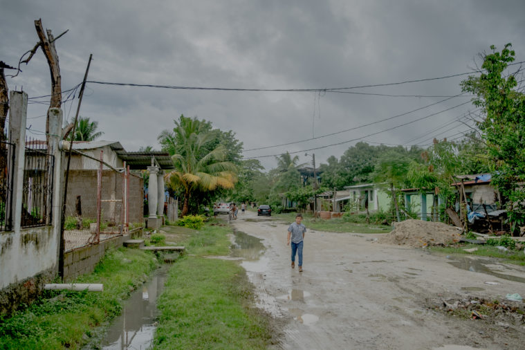 Joseph walks to Sunday school at the local church in La Rivera Hernandez, San Pedro Sula.