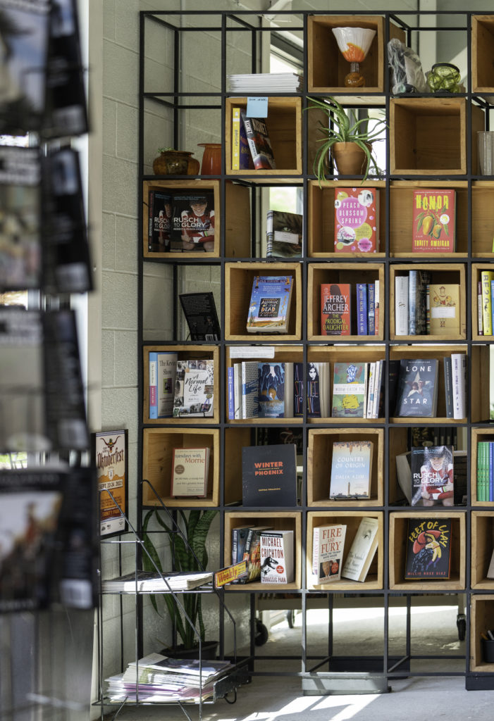 Floor to ceiling display shelves offer enticing books from Michael Crighton to Melissa Fu.