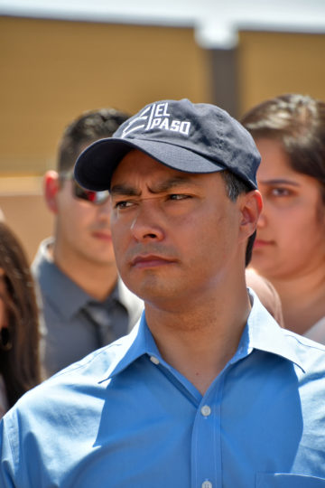 Joaquin Castro in a blue button-down and black El Paso baseball cap.