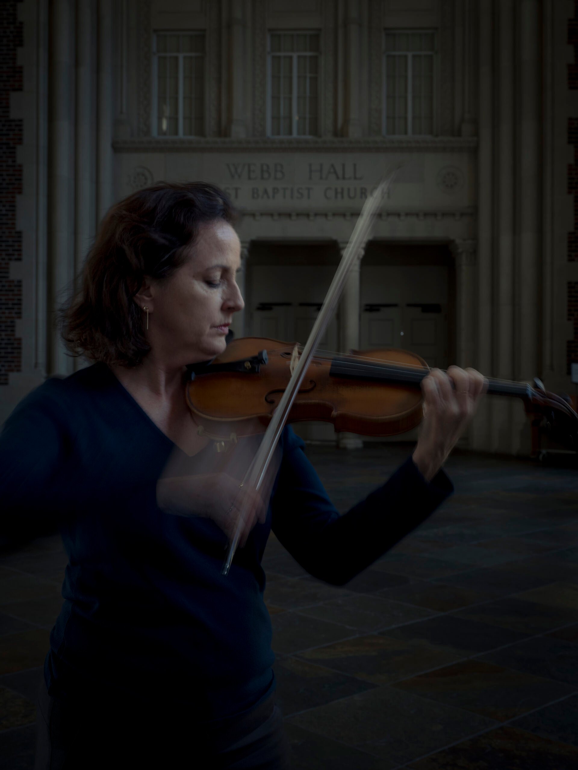 Violinist Angela Caporale performs for a portrait while rehearsing for an upcoming performance with The San Antonio Philharmonic with Conductor Tito Muñoz at First Baptist Church in San Antonio, Tx. U.S., on Thursday, January 12, 2023. The Symphony Society which ran the San Antonio Symphony declared bankruptcy in 2022 and dissolved shortly thereafter, canceling its planned season and putting its musicians out of work. The musicians reorganized as the San Antonio Philharmonic which is currently in the midst of its spring season.