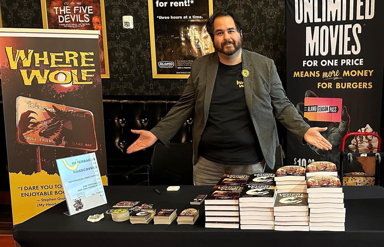 Robert Saucedo poses at a book signing at the Alamo Drafthouse.