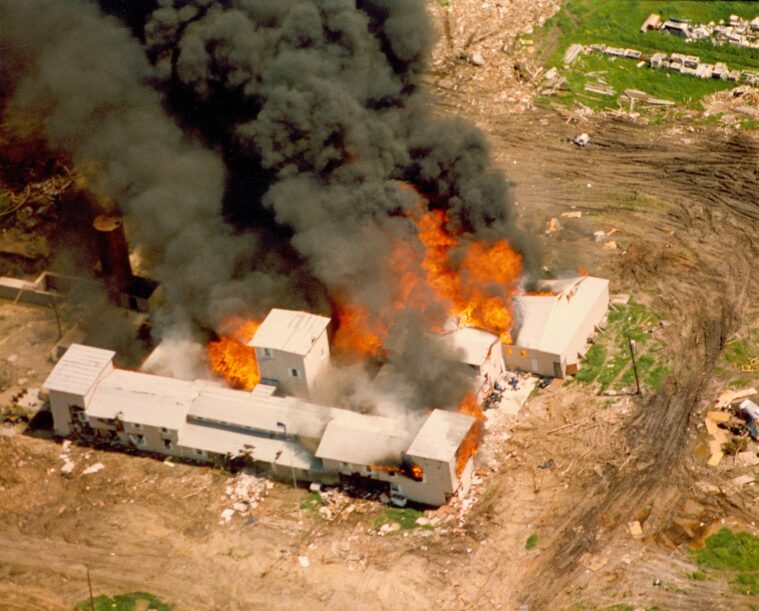 The Branch Davidian compound in Waco, Texas almost fully engulfed in flames, as seen from the air on April 19, 1993.