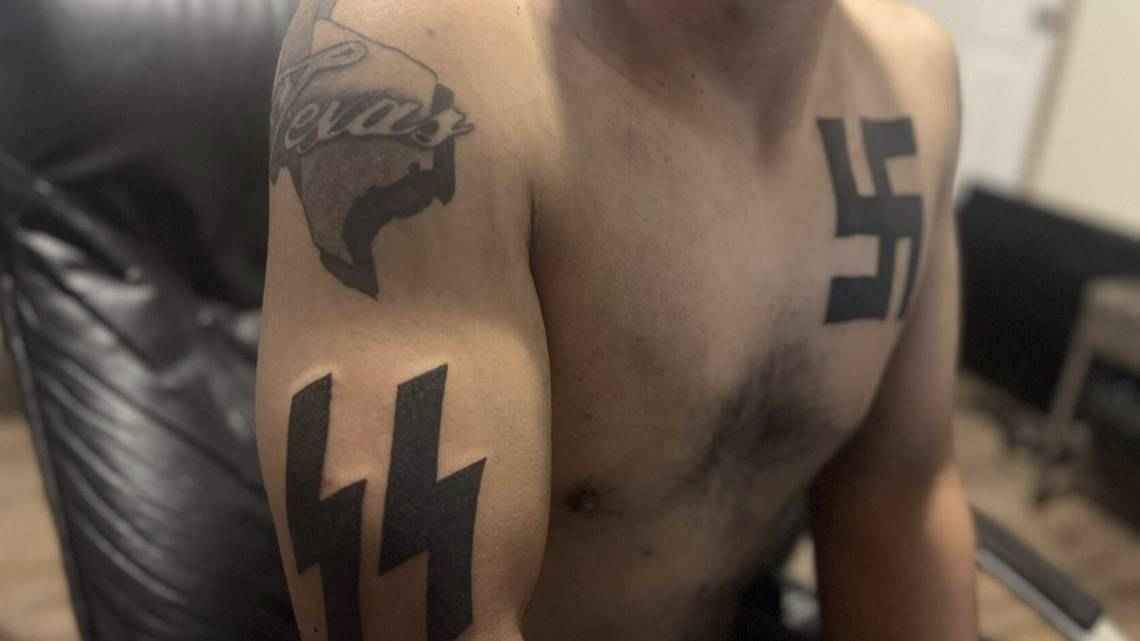 A photo of the torso of Mauricio Garcia, the neo-nazi responsible for the Allen shooting, showing off his SS and swastika nazi tattoos.