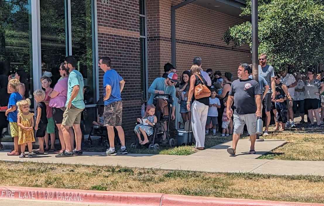 A crowd lines up outside the Brave Books event at the Taylor Public Library.