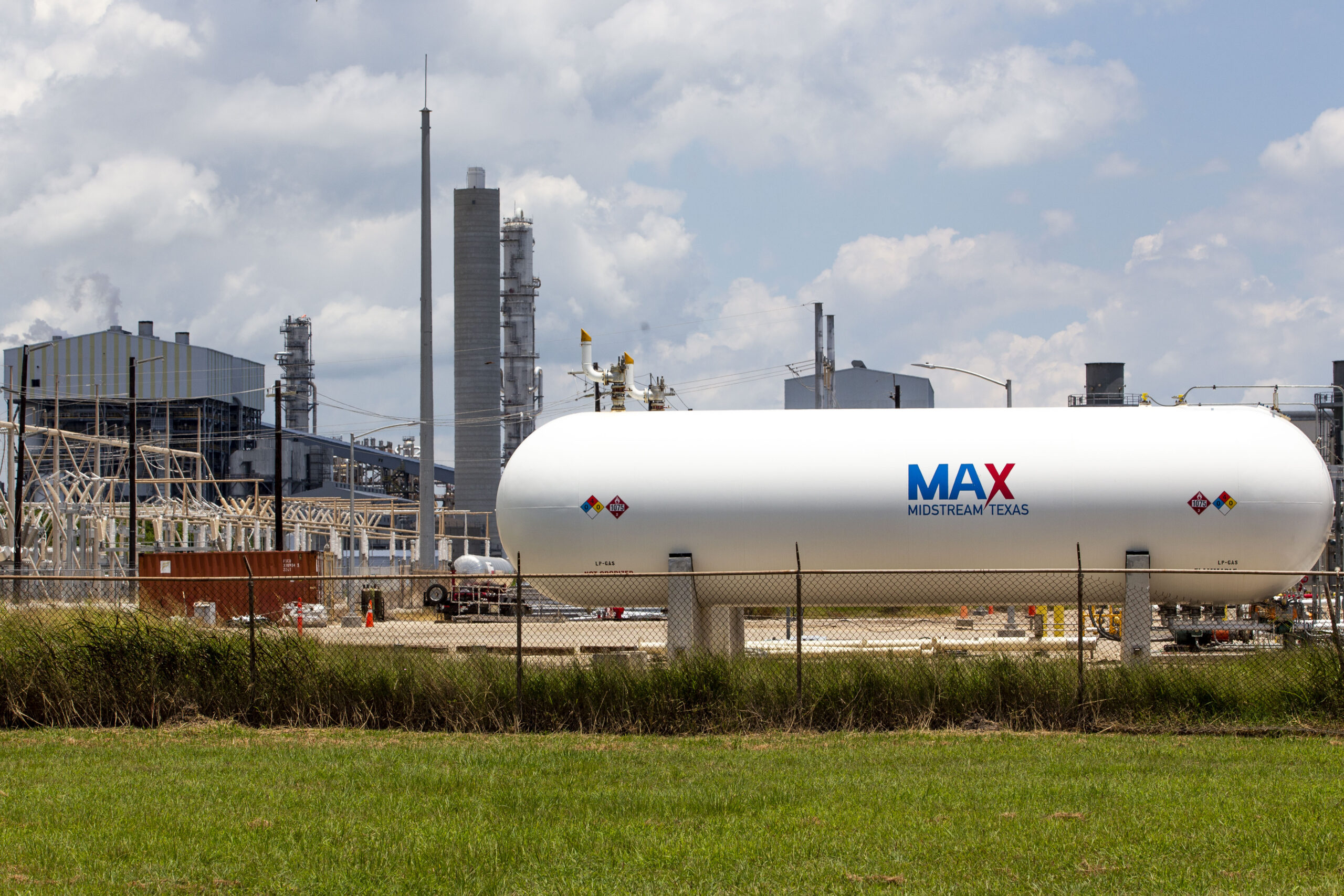 A branded storage tank can be seen outside the Max Midstream oil and gas refinery in Port Arthur, Texas.