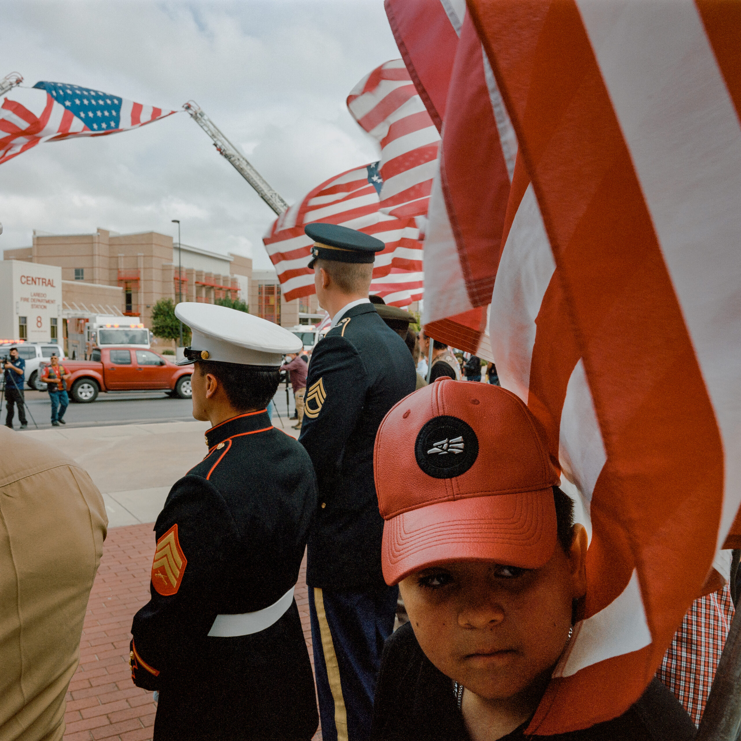 Members of the military and the Laredo community stand to greet David Lee Espinoza's casket in Laredo.