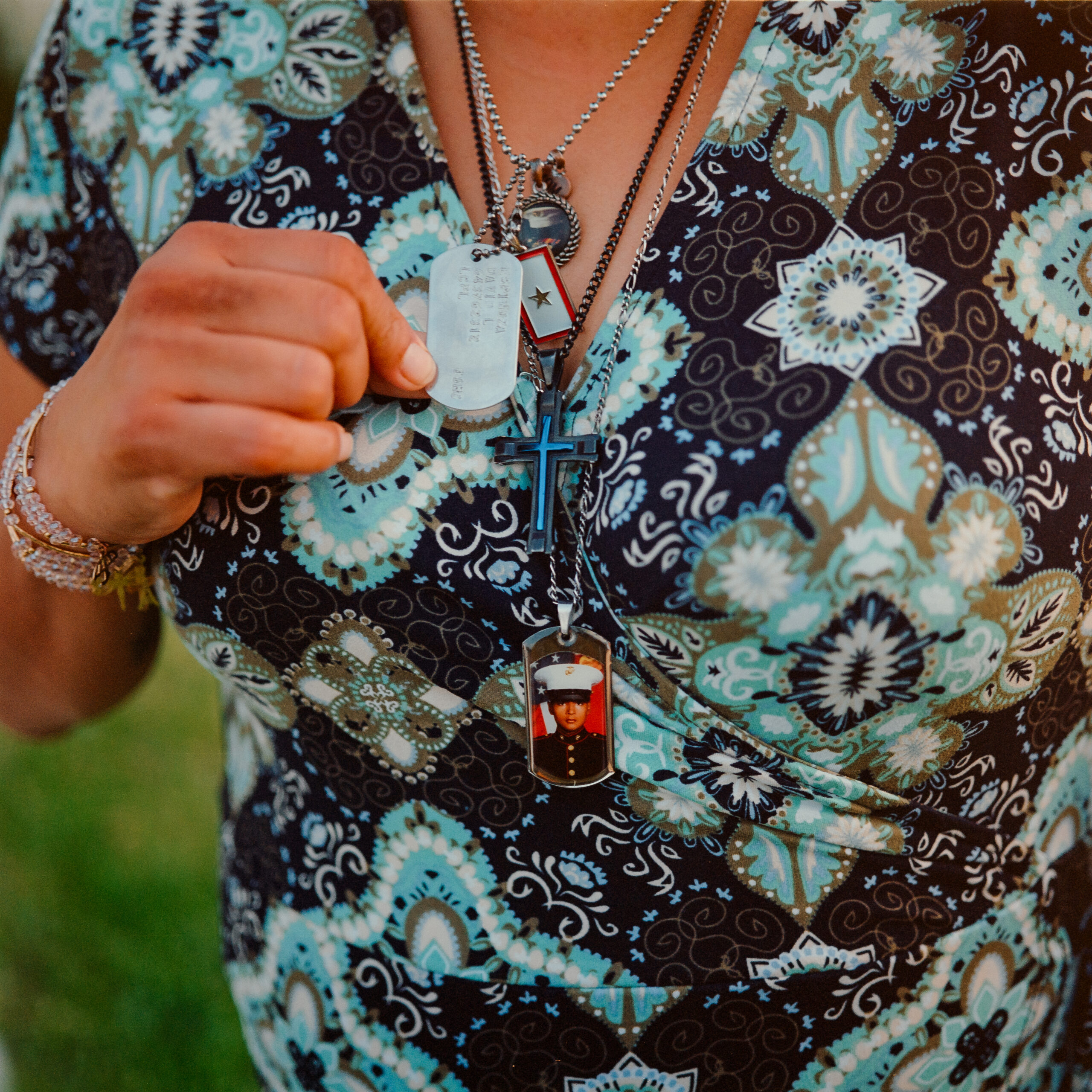 Elizabeth Holguin wears her son’s dog tags to keep his memory alive.