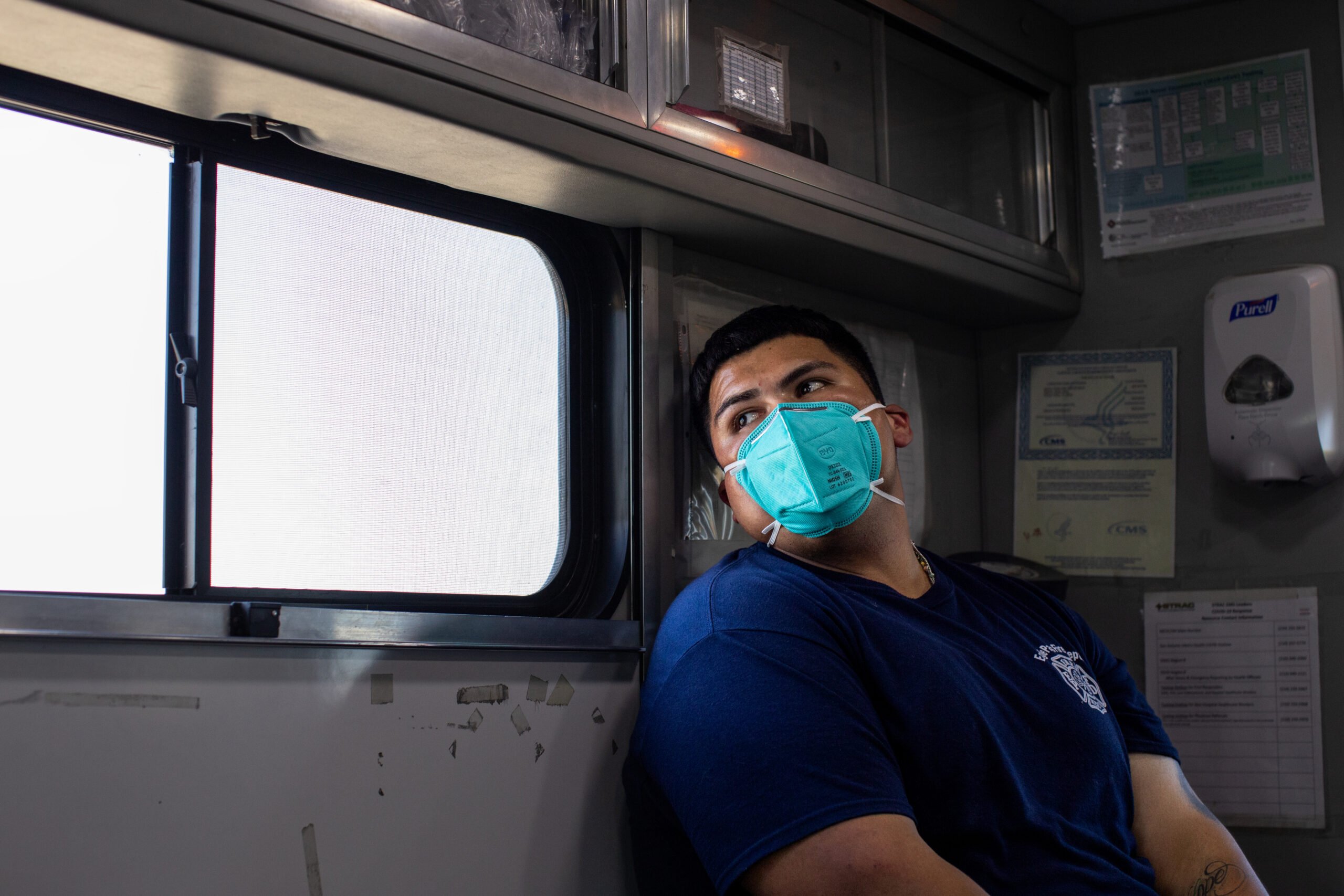 Jose Escamilla, 23, looks out the window of an ambulance while transporting a patient to the Fort Duncan Regional Medical Center during his first 24 hour shift on Aug. 04, 2023. Escamilla is one of the department’s newest hires and recently received his EMT certification, allowing him to be scheduled for full shifts, though he’s only permitted to respond to EMS calls until he receives his fire certification.