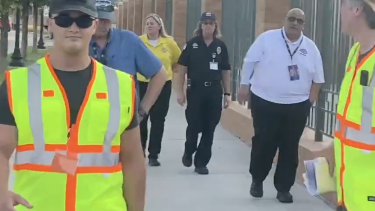 Matteo Sheffield is escorted off Dickies Arena property on August 20.