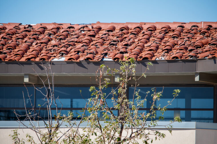 A terra cotta rood showing severe hail damage