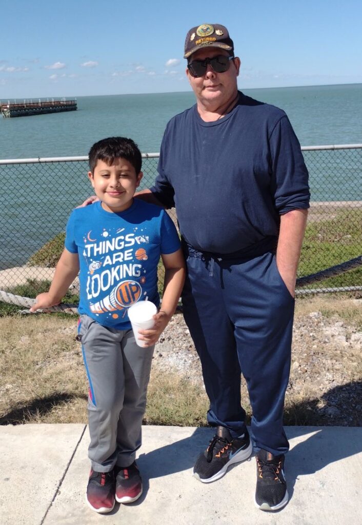 Timothy and his father, also Timothy Murray, in front of the seashore at South Padre Island in November 2021