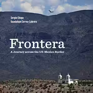 The cover of Frontera shows a tiny, old white church, whose twin steeples are dwarfed by the mountains and empty desert surrounding them.
