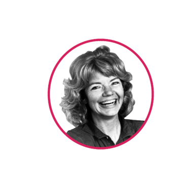 Portrait of Molly Ivins smiling in black and white